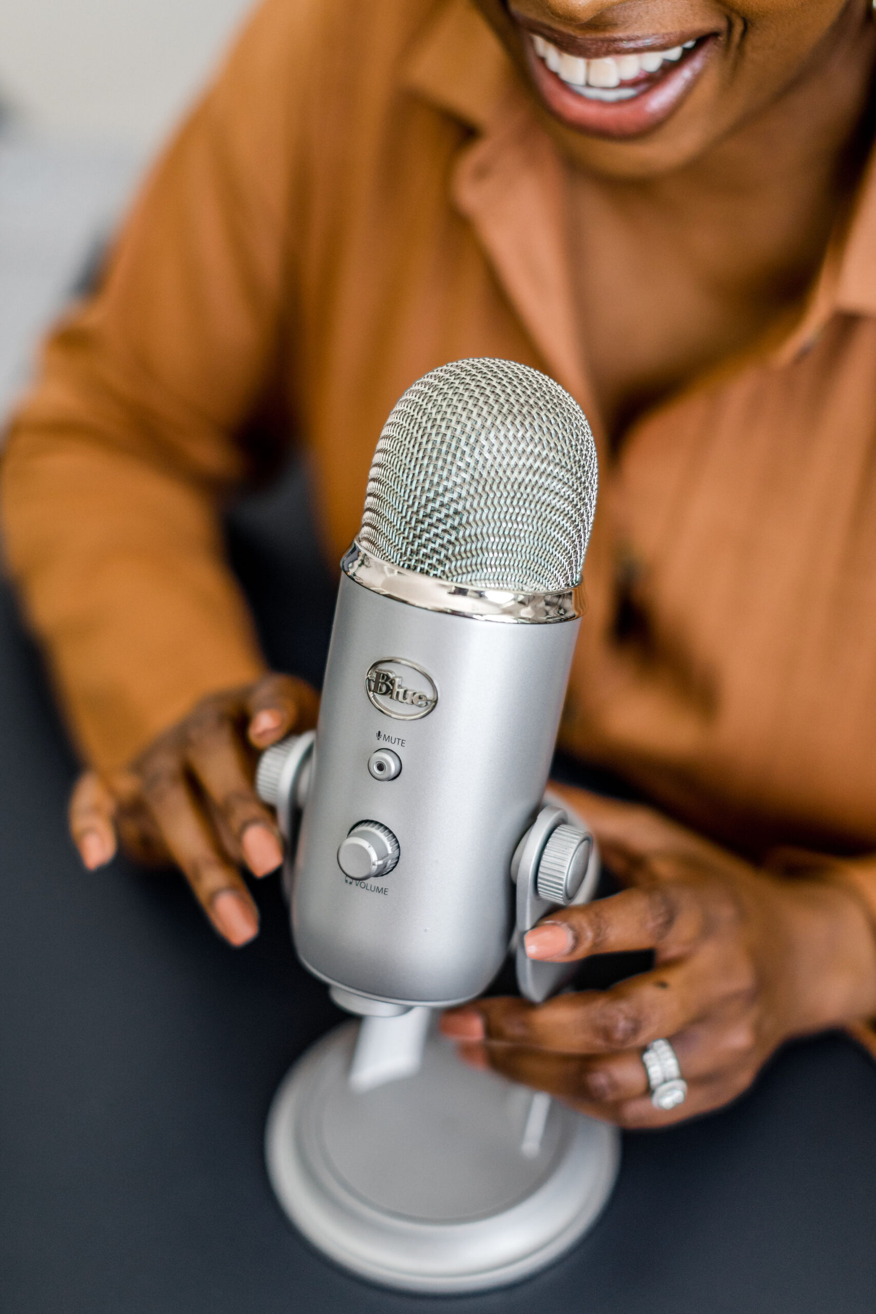 Black woman speaking into microphone