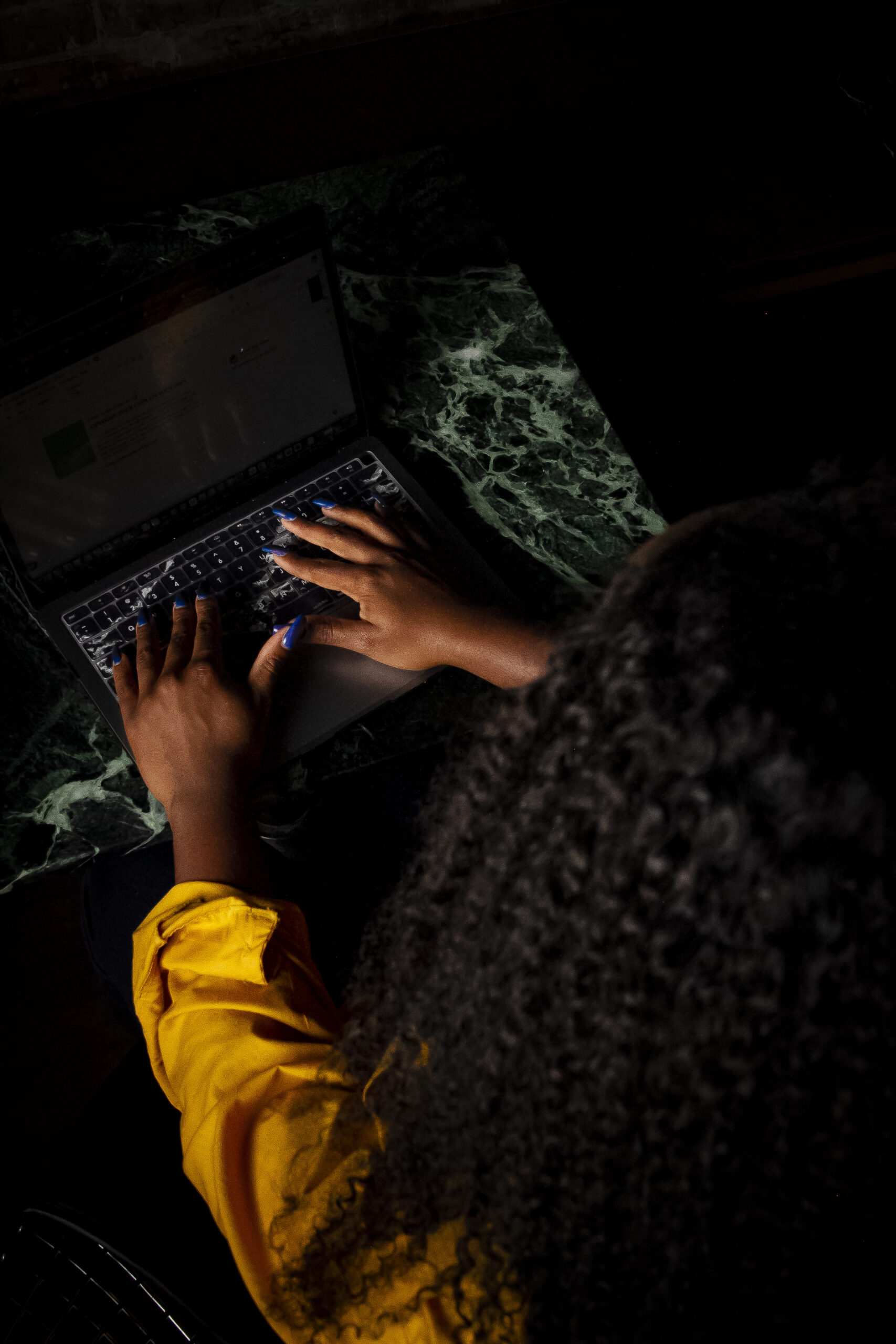 Woman typing on laptop